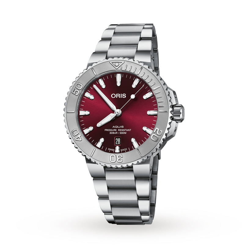 The Oris Aquis Date Relief features a stainless steel case and bracelet, a red gradient dial with silver hour markers, a rotating bezel, and a date display at the 6 o’clock position.