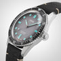 An Oris Divers Sixty‑Five wristwatch featuring a silver case, black leather strap, and turquoise hour markers set against a white dial.