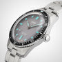 A close-up of the Oris Divers Sixty-Five wristwatch featuring a gray dial, turquoise markers, and a stainless steel strap.