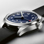 Close-up of the Oris Big Crown Pointer Date Calibre 403 wristwatch with a black leather strap, blue dial, white numerals, and silver casing, displaying the time at 10:10.