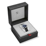 The Oris Big Crown Pointer Date Calibre 403 wristwatch, featuring a black strap and blue dial, is displayed in an open black and gray Oris-branded watch box.