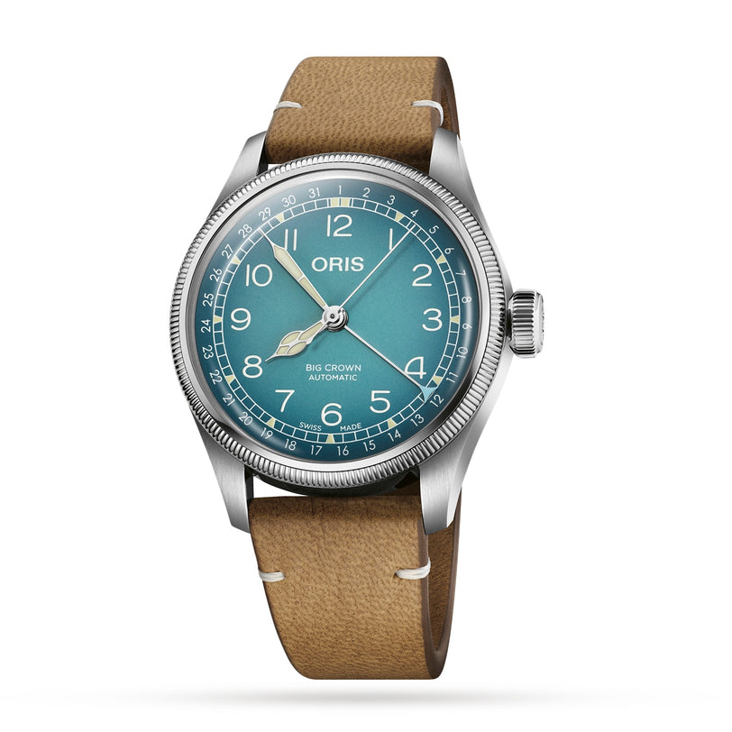 The Oris Big Crown X Cervo Volante wristwatch features a teal dial, silver case, luminous hands, Arabic numerals, and a brown leather strap—a timepiece crafted for professional pilots.
