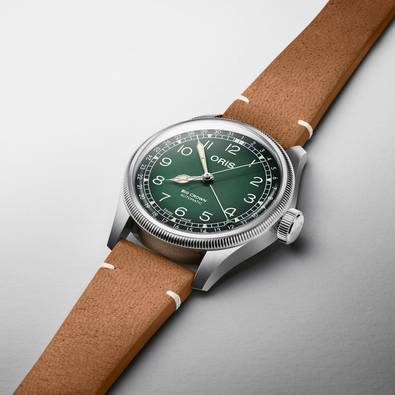Oris Big Crown Oris X Cervo Volante flat on a white metal background