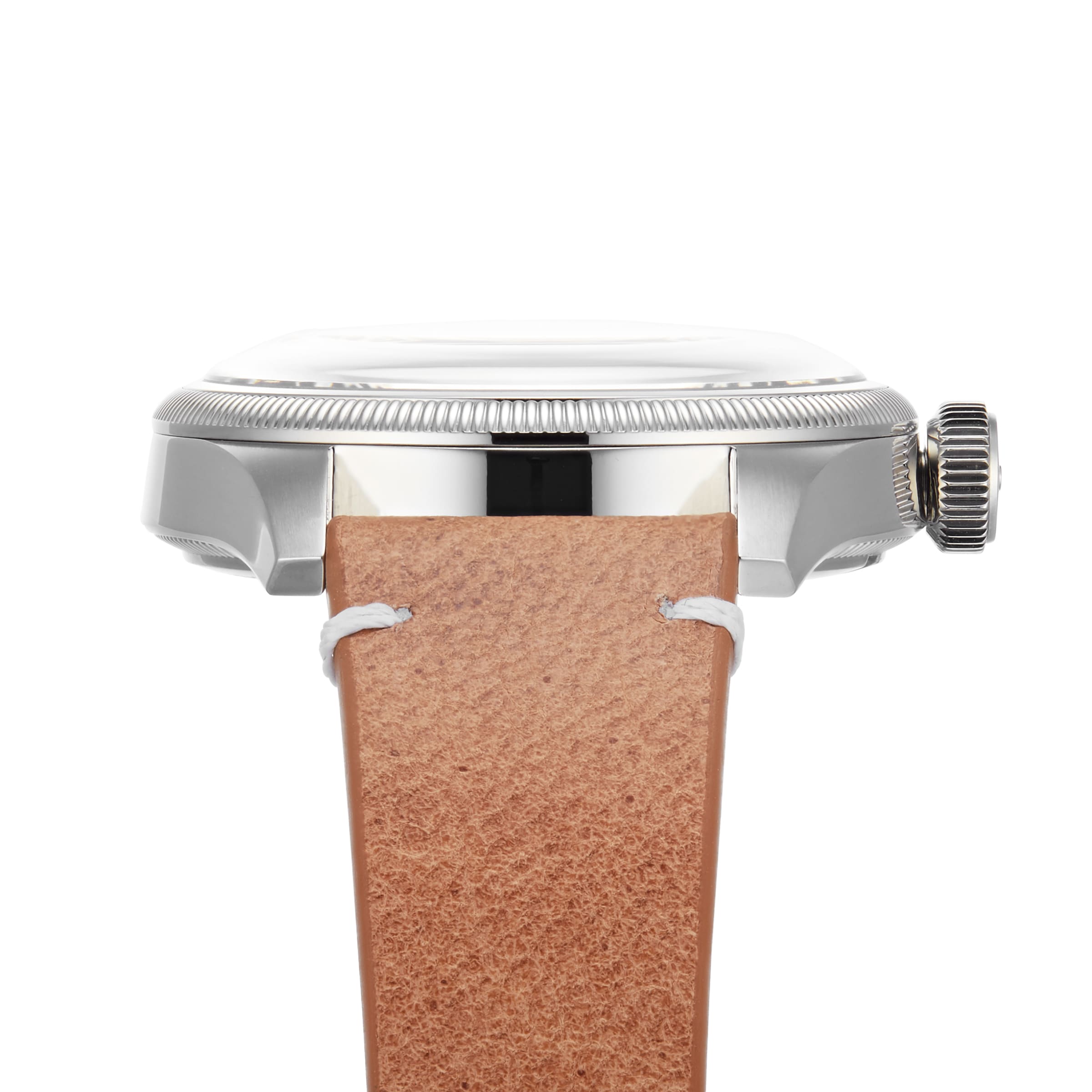 Side view of the Oris Big Crown Oris X Cervo Volante watch, showcasing its stainless steel case, ridged bezel, crown, and a tan leather strap with prominent white stitching.