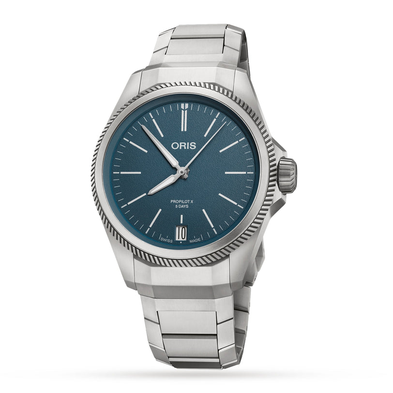 The Oris ProPilot X Calibre 400 features a stainless steel case, blue dial, silver hands and markers, date at 6 o’clock, and metal bracelet—an elegant tribute to aviation heritage.