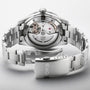 The Oris Divers Sixty‑Five 12H Calibre 400 features a silver-tone metal bracelet and an open case back that displays its automatic movement.