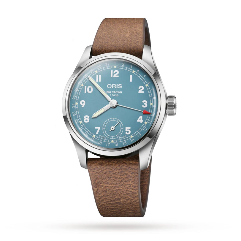 The Oris Big Crown Pointer Date Calibre 473 is a classic pilots watch with a blue dial, white numerals, red-tipped date hand, and brown leather strap—powered by the reliable hand-wound calibre 473.