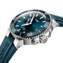 A close-up of the Oris Aquis Small Second Date diver’s watch, showcasing its teal dial, matching rubber strap, rotating bezel, prominent crown, date display, and water-resistant design.