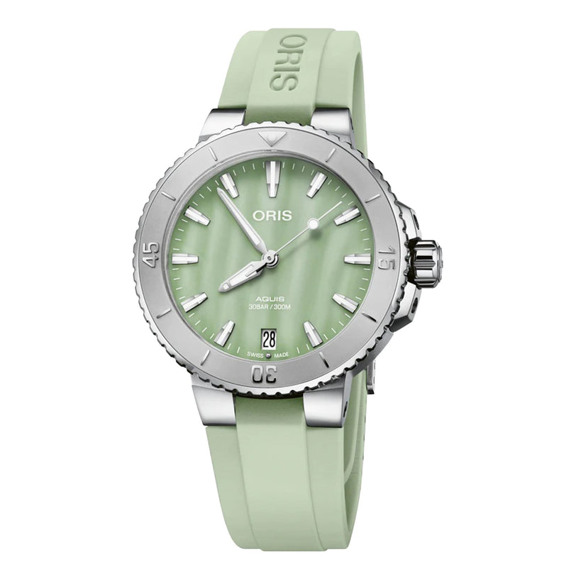 The Oris Aquis Date is a stainless steel diver’s watch with a light green dial, matching rubber strap, date display, and unidirectional bezel.