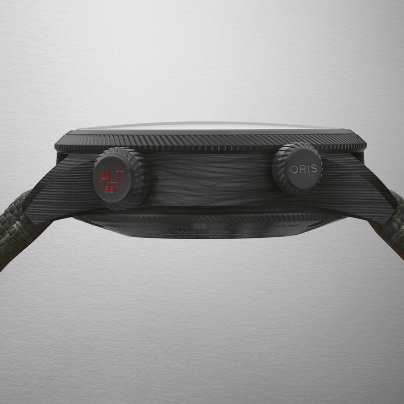 A side view of the black Oris ProPilot Altimeter wristwatch shows its textured case and two crowns, one marked ALT SET in red.