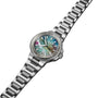 The Oris Aquis Date Upcycle wristwatch, crafted in stainless steel with a metal band and multicolored mother-of-pearl dial, showcases sustainable luxury and elegant time display against a plain white background.