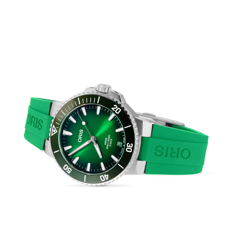 The Oris Aquis Date Calibre 400 features a green dial, silver bezel, and green rubber strap, shown at an angle on a white background—a striking diving watch from Oris.