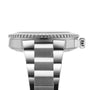 Side view of the Oris Aquis Date, showcasing its brushed metal bracelet, case, notched bezel edge, and crown—signature features of Oris’s acclaimed mechanical dive watches.
