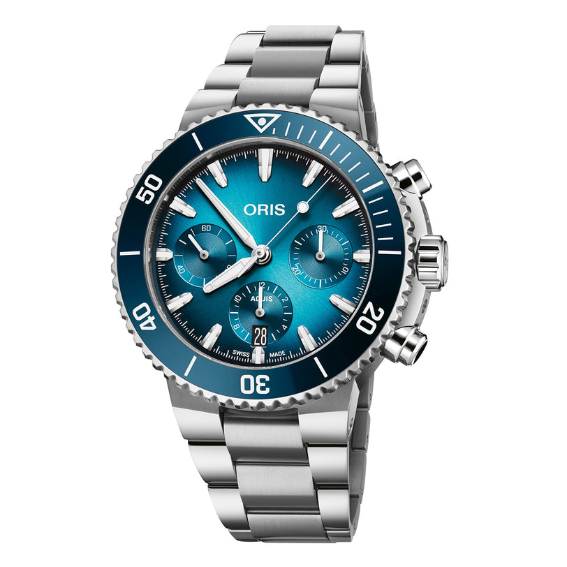 The Oris Aquis Chronograph features a stainless steel case, blue ceramic bezel, blue dial with three subdials, a date window at 6 o’clock, and silver hour markers, presented at a slight angle.