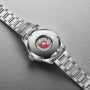 The Oris Big Crown Pointer Date is shown face down, revealing its transparent case back and visible Swiss Made automatic mechanical movement with Oris branding.