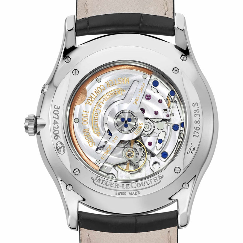 The Master Ultra Thin Reserve De Marche by Jaeger-LeCoultre features a transparent case back revealing its intricate automatic movement, detailed engravings, and is elegantly paired with a black leather strap.