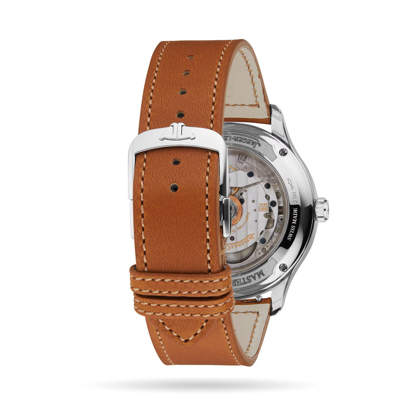 A close-up of the Jaeger-LeCoultre Master Control Date shows a brown leather strap with white stitching, stainless steel case, and an exposed 899 calibre movement visible through the transparent case back.