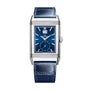 The Jaeger-LeCoultre Reverso Tribute Geographic is a rectangular Art Deco-style watch featuring a blue face, silver casing, blue leather strap, and top-dial date display.
