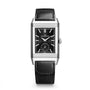 The Jaeger-LeCoultre Reverso Tribute Duoface Small Seconds is a rectangular steel watch with a black dial, silver hands and markers, small seconds subdial, and a sleek black leather strap.