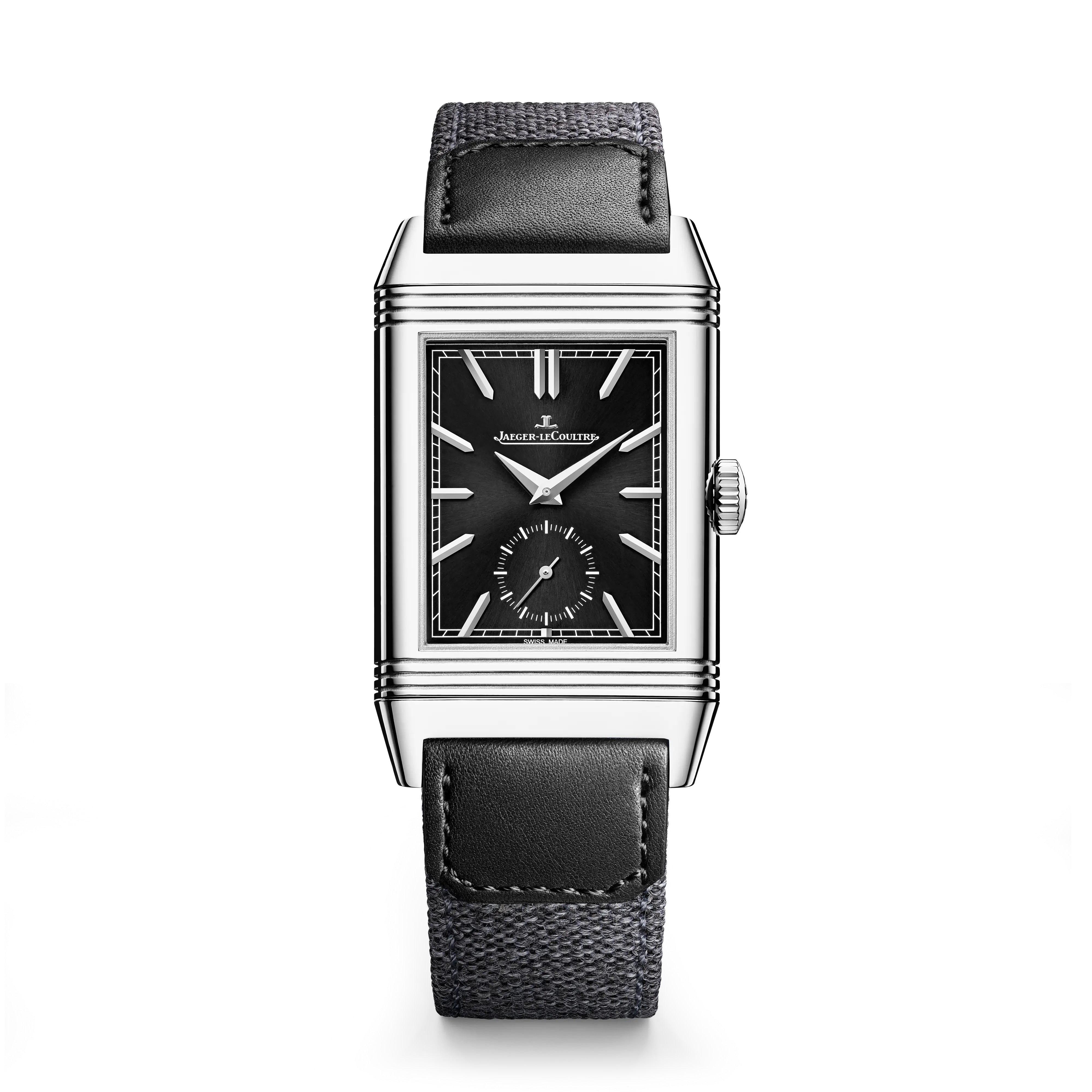 The Jaeger-LeCoultre Reverso Tribute Duoface Small Seconds is a rectangular steel wristwatch featuring a black dial with silver markers, a small seconds subdial, and a black leather strap. The brand name appears on the watch face.