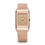 The Jaeger-LeCoultre Reverso Tribute Monoface Small Seconds is a rectangular rose gold wristwatch with a mesh band, golden grained dial, minimalist display, and small seconds subdial, shown against a white background.