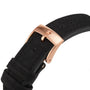 Close-up of a black suede watch strap with a rose gold buckle engraved with a star, perfectly matching the 18K rose gold case of the Zenith Chronomaster Sport.