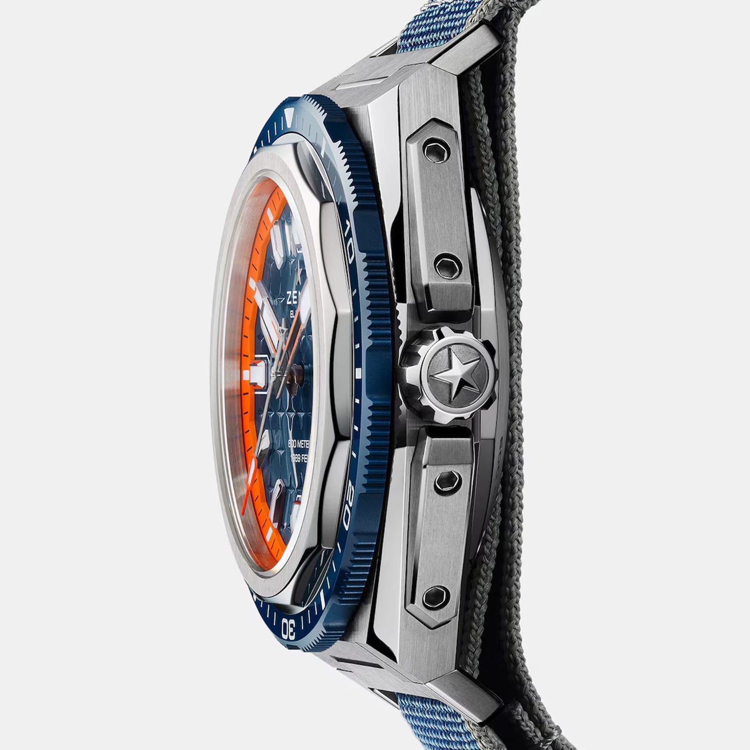 Side view of the Zenith Defy Extreme Diver wristwatch featuring a blue bezel, orange accents, and a fabric strap.