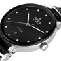 Close-up of the Rado Centrix Automatic Diamonds wristwatch featuring a black dial, diamond hour markers, date display at 6 oclock, and a stainless steel case and band with sapphire crystal.