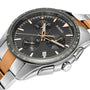 Close-up of the Rado Hyperchrome Chronograph featuring a black dial, silver and gold accents, three subdials, date display, and a two-tone bracelet crafted from high-tech ceramic.