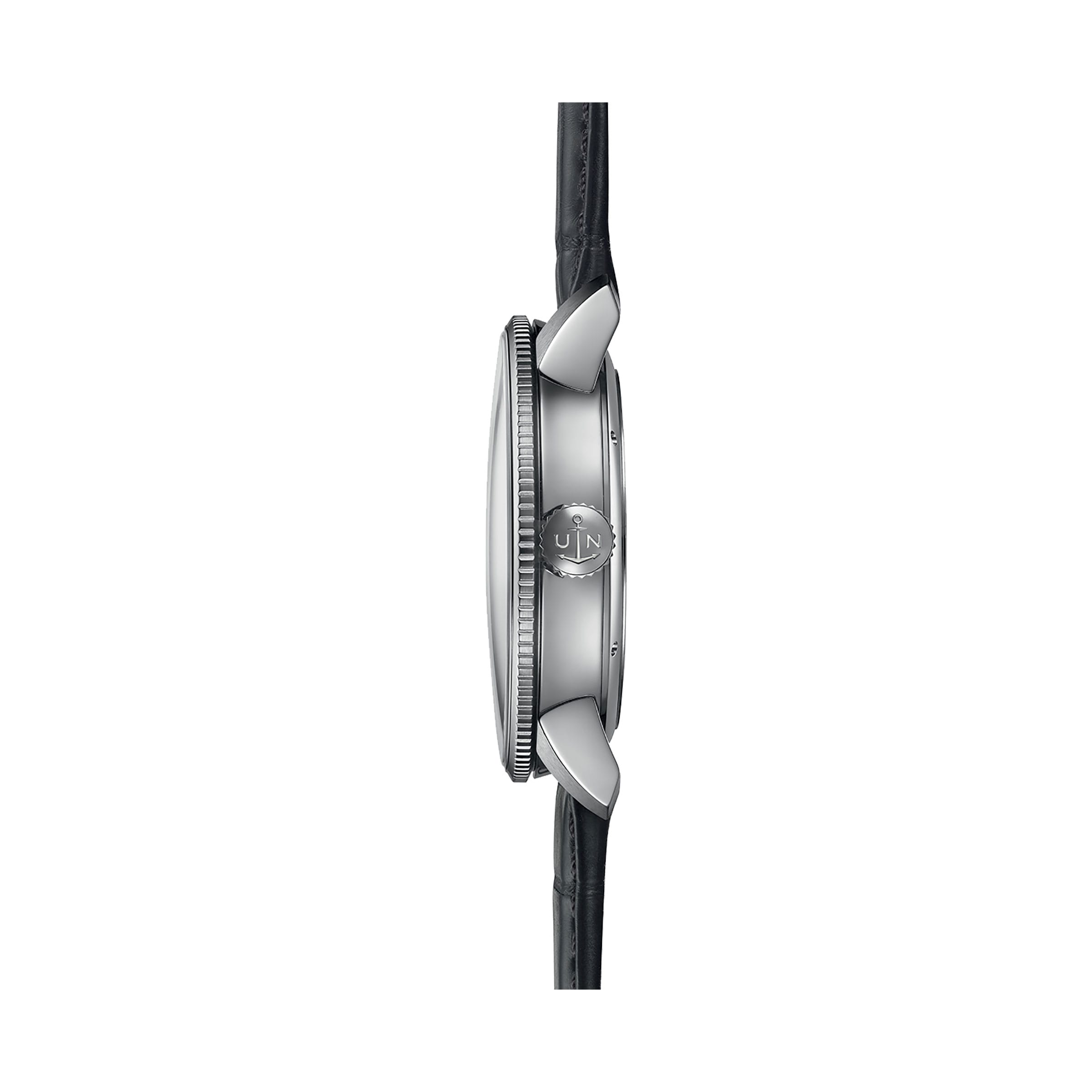 Side view of the Ulysse Nardin Marine Torpilleur wristwatch with a round silver case, logo-engraved crown, black leather strap, and elegant Roman numeral indexes on its dial.