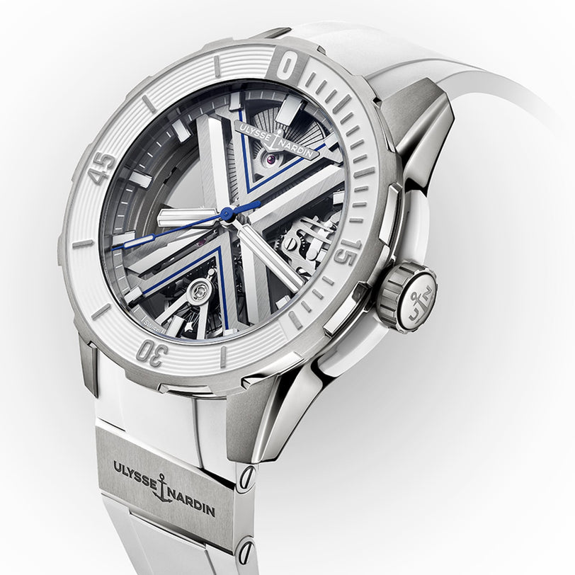 The Ulysse Nardin Diver X Skeleton features a white strap, titanium case, and an open-worked dial with geometric accents and exposed mechanisms.