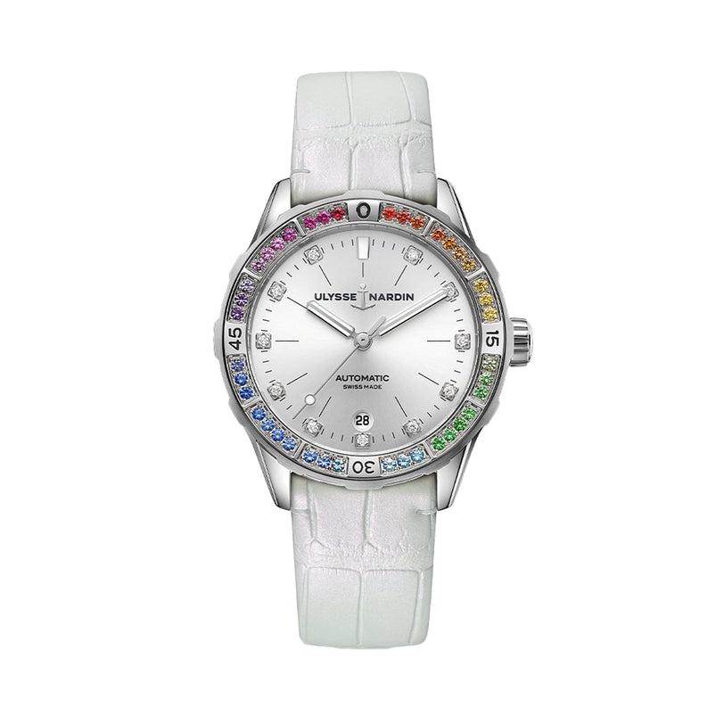 The Ulysse Nardin Diver Rainbow 39 is a silver automatic watch featuring a white textured strap and a bezel set with multicolored gemstones.