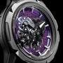 Close-up of the Ulysse Nardin Freak S WOS Centenary Exclusive wristwatch with a metallic case, exposed gears, and a shimmering purple dial—a true masterpiece from the Freak collection.