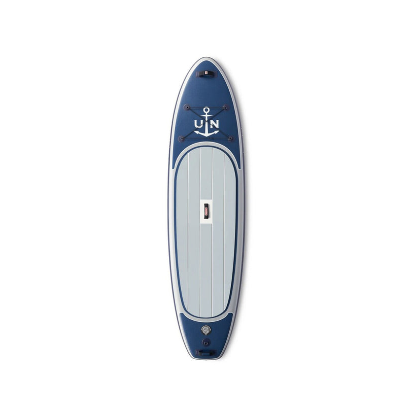 The Ulysse Nardin Diver X Beau Lake is a blue and white luxury ISUP paddle board with an anchor graphic, compass letters, and a central handle, displayed from above on a plain white background.