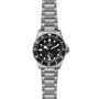 A TUDOR Pelagos stainless steel divers watch with a black rotating bezel, black dial, luminous markers, date window at 3 o’clock, and a link bracelet.