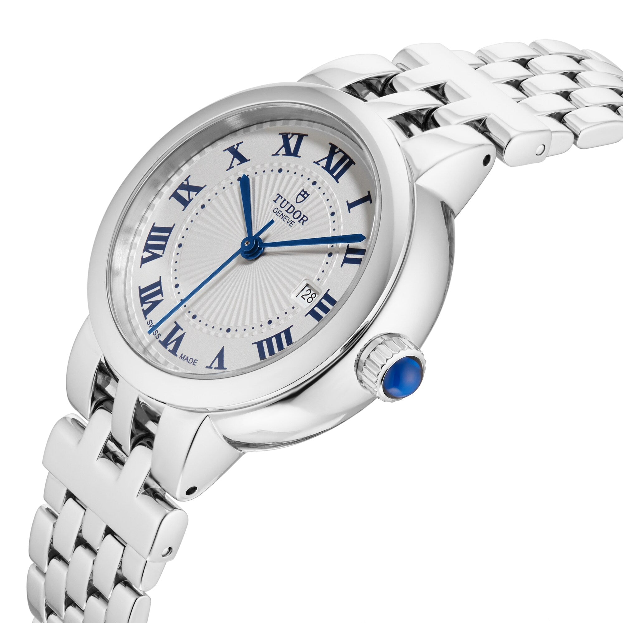 The TUDOR Clair de Rose is a silver wristwatch featuring blue Roman numerals, a date display, and a silver metal link band.