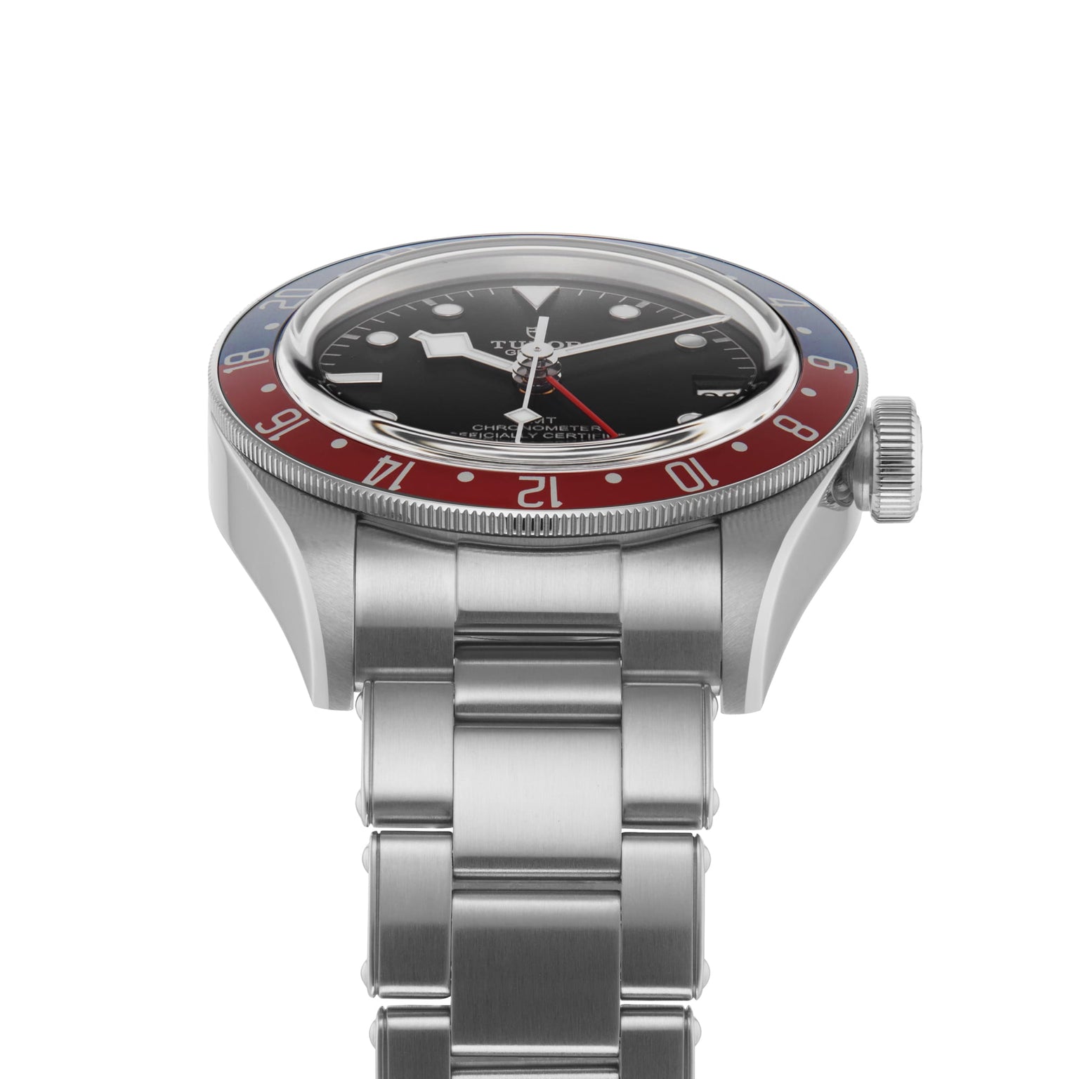 A TUDOR Black Bay GMT wristwatch in stainless steel with black dial, red and blue bezel, and metal bracelet, viewed from the front left—an iconic model inspired by classic diving watches.