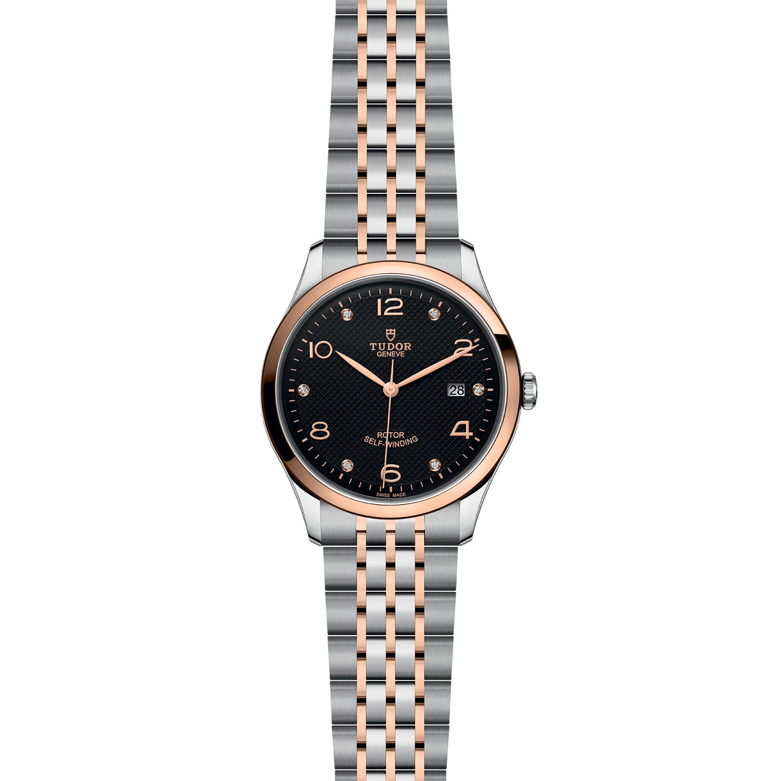 The TUDOR 1926 wristwatch features a black dial, gold-tone numerals, and a silver and rose gold bracelet, with date display at 3 o’clock.