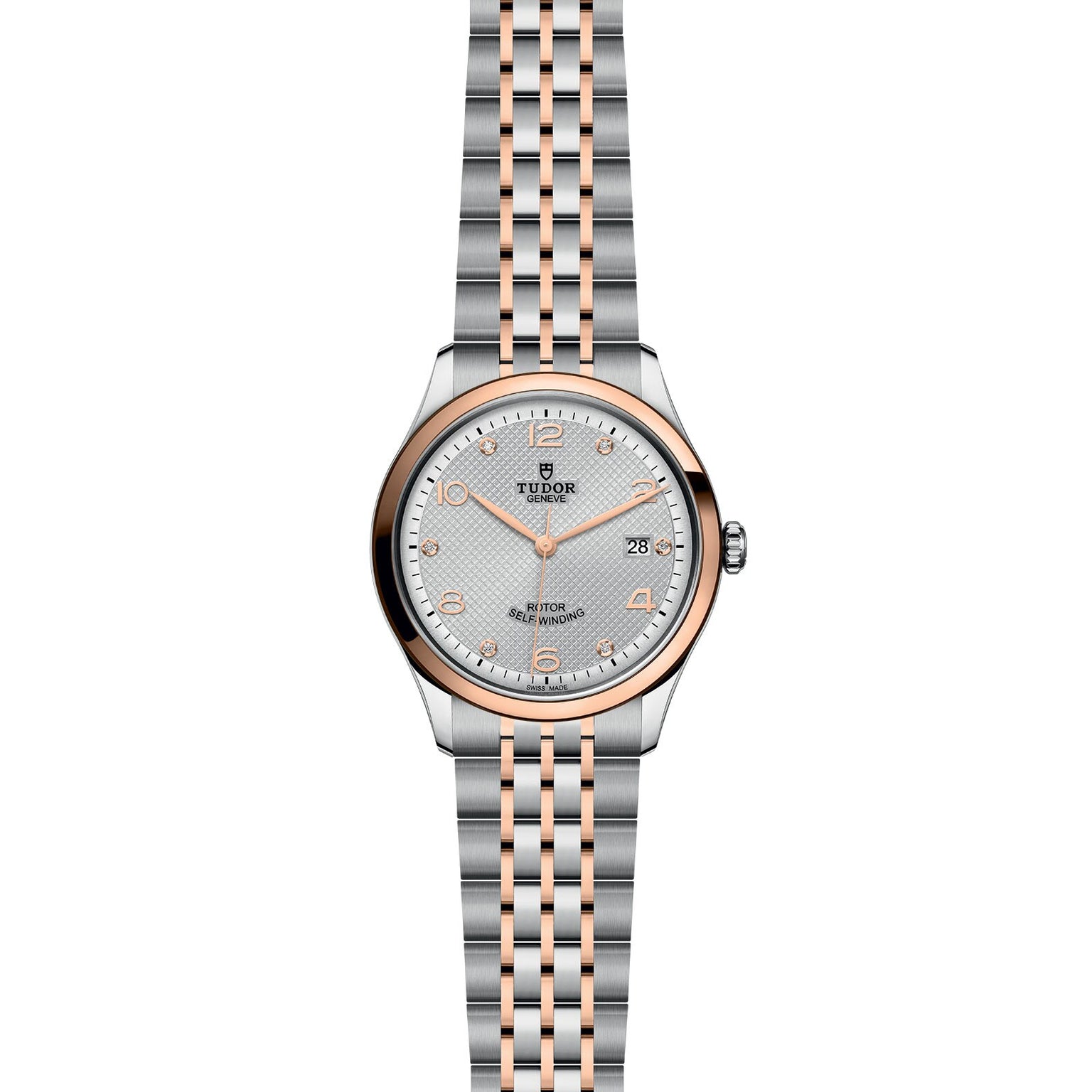 The TUDOR 1926 features a silver and rose gold case, metal link bracelet, round face, date at 3 o’clock, and dot hour markers on a textured silver dial—ideal for fans of classic mechanical watches.
