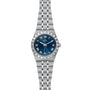 The TUDOR Royal is a stainless steel and gold wristwatch featuring a blue dial, Roman numerals, fluted bezel, date window at 3 o’clock, and embodies the automatic sport-chic style.