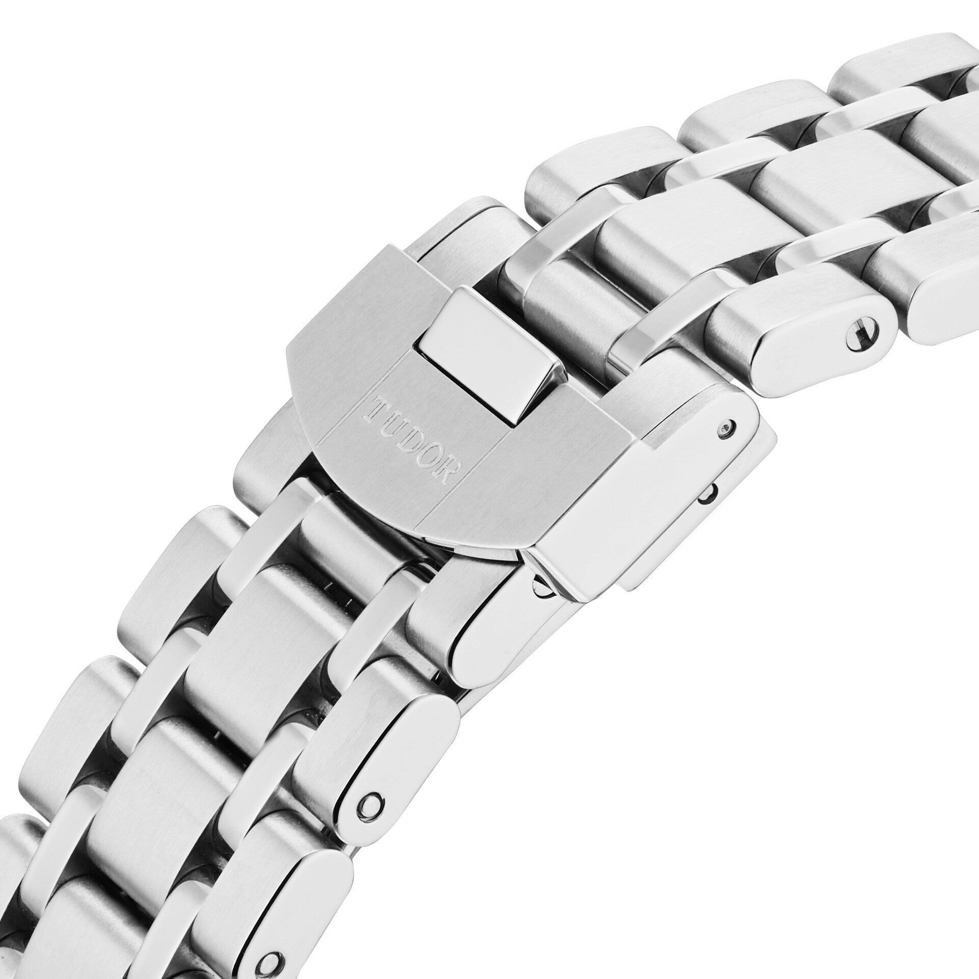 Close-up of a stainless steel integrated bracelet with folding clasp engraved TUDOR, highlighting the refined design of the TUDOR Royal automatic sport-chic watch.