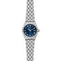 A TUDOR Royal wristwatch in silver featuring a blue dial, Roman numerals, and a metal link bracelet.