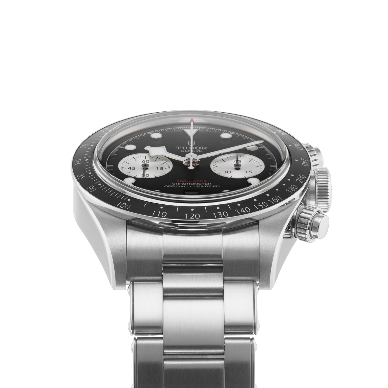 The TUDOR Black Bay Chrono is a stainless steel wristwatch featuring a tachymetric black bezel, black dial, three white subdials, and a metal bracelet, displayed at an angle against a white background.