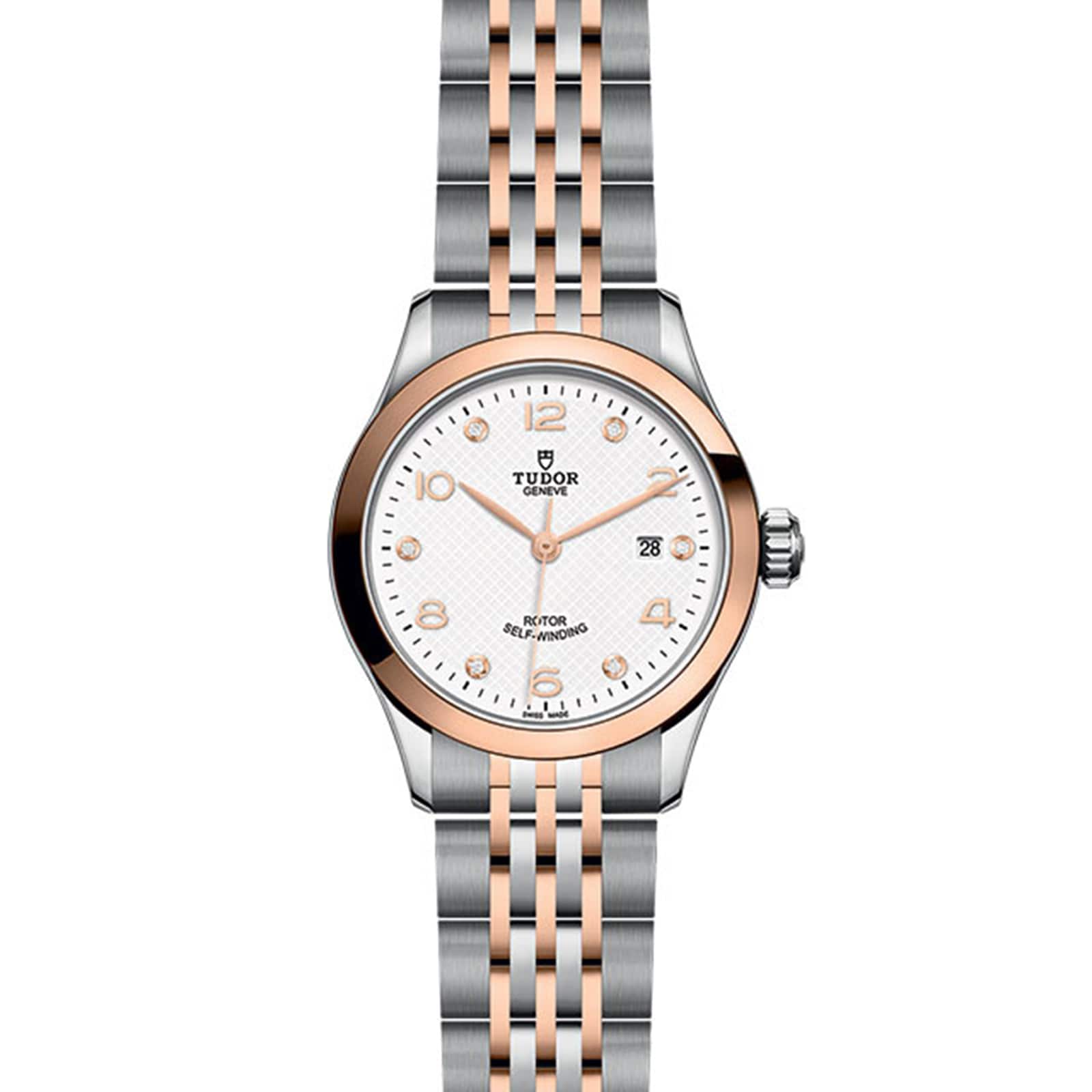 The TUDOR 1926 features a silver and rose gold two-tone band, white dial, gold hour markers, and a date display at 3 o’clock—an elegant wristwatch for refined tastes.