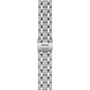 The TUDOR Royal watch features a stainless steel bracelet with a five-link design and branded clasp, displayed from a top-down perspective.