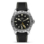 The TUDOR Black Bay Pro is a neo-vintage wristwatch inspired by classic Tudor divers, featuring a black dial, large luminescent markers, rotating bezel, date window at 3 o’clock, and a black textured strap with white stitching.