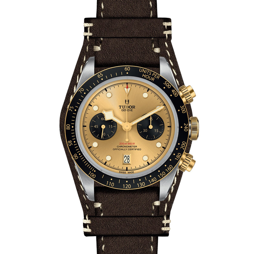 The TUDOR Black Bay Chrono S&G is an automatic sport-chic wristwatch featuring a brown leather strap, gold and black dial with two subdials, black bezel, and gold pushers and crown for timeless style.