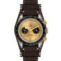 The TUDOR Black Bay Chrono S&G is an automatic sport-chic wristwatch featuring a brown leather strap, gold and black dial with two subdials, black bezel, and gold pushers and crown for timeless style.