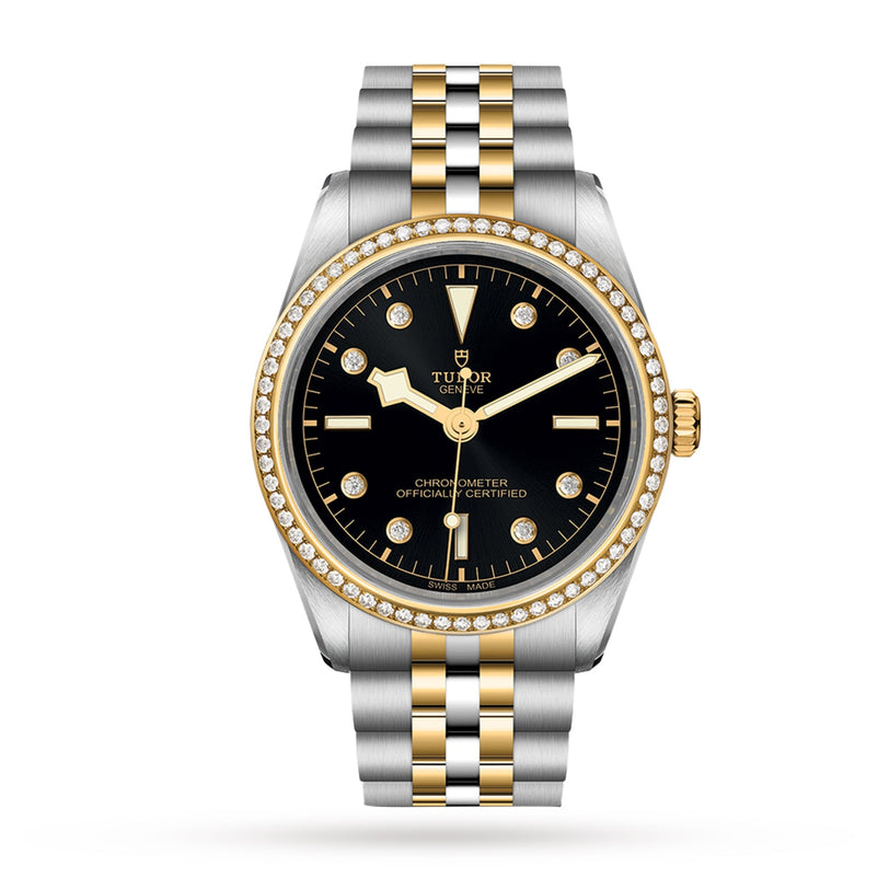 The TUDOR Black Bay One 36 S&G wristwatch features a black dial, diamond-set yellow gold bezel, and a two-tone silver and yellow gold bracelet.