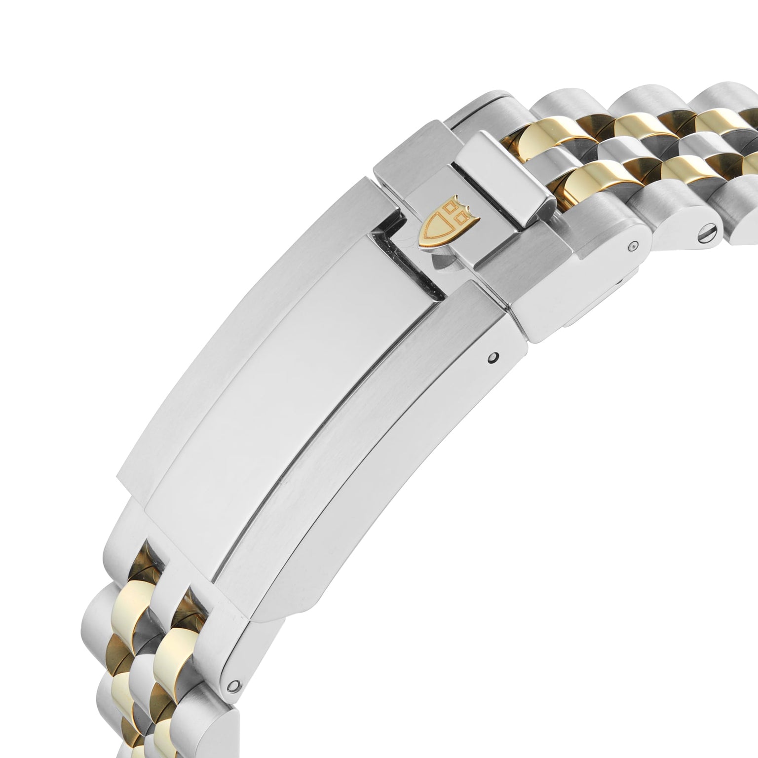 Close-up of a TUDOR Black Bay One 36 S&G clasp and bracelet, showing alternating silver and yellow gold links with the shield logo engraved on the clasp.